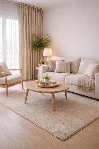 a living room with a couch and a coffee table at Hostal Palma Hermosa in El Puerto de Santa María