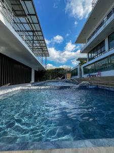 a swimming pool in front of a building at The Hermitage Tagaytay-Presidential Suite in Malabag +18 photos