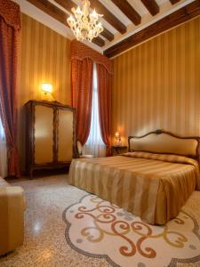 Postel nebo postele na pokoji v ubytování Centauro Hotel + 26 fotografií