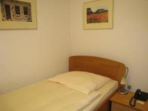 Ένα ή περισσότερα κρεβάτια σε δωμάτιο στο Posthotel Hans Sacks
