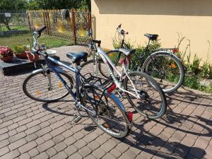 two bikes parked next to each other on a driveway at 9 Dańce - comfortable accommodation 22-220 - WIFI included in Dańce