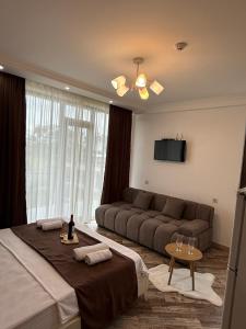a living room with two beds and a couch at White-House in Ureki