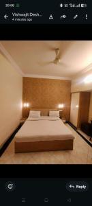 a bedroom with a large bed in a room at New Vivaantaa Hotel in Aurangabad