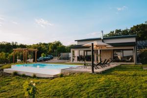 a house with a swimming pool in a yard at Villa Infinity View in Široki Brijeg