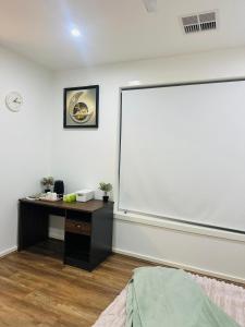 a classroom with a large whiteboard on the wall at Mickleham Prestige Homestay in Mickleham