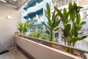 a balcony of a building with plants on it at 5BR Home - BBQ - City Centre - Free Pick Up for 3 nights in Ho Chi Minh City