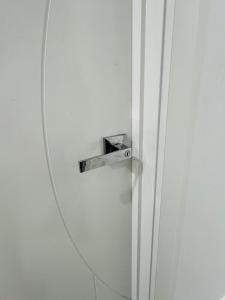 a mirror hanging on a wall next to a door at Mickleham Prestige Homestay in Mickleham +2 photos