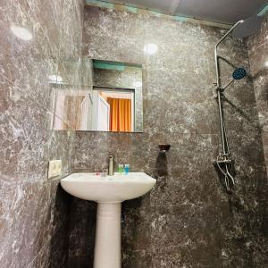 a bathroom with a sink and a shower at Mini hotel in centre in Yerevan