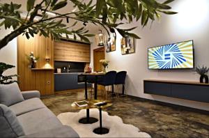 a living room with a couch and a table at Oblivion 1 in Velingrad