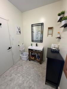 a bathroom with a sink and a mirror at A Stay Across The Bay in Curling +24 photos