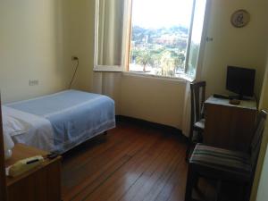 Rúm í herbergi á Albergo Bandoni