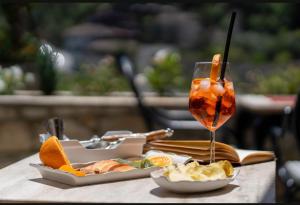a table with a drink and a plate of food at Guest House J.Prifti in Berat +46 photos