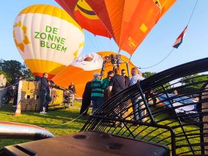 a group of people flying hot air balloons at Sky Ballonvaarten & Accommodaties in Tilburg