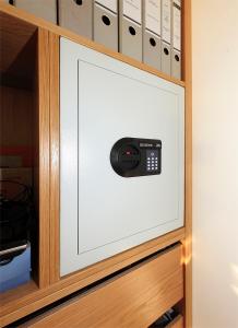 a television with a remote control in a cabinet at Luxury Beachfront Villa Smague with Sauna, Zadar in Diklo
