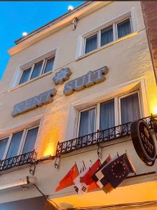 a hotel sign on the side of a building at Mardin Kent Suit Hotel in Mardin