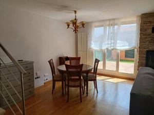 a dining room with a table and chairs at Casa Río Tera in Garray +28 photos