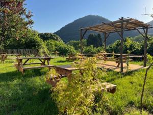 a group of picnic tables in a field at Maquis in Mialet