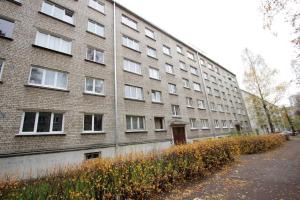 a large brick building with a lot of windows at Gallo Riga Apartments in Riga