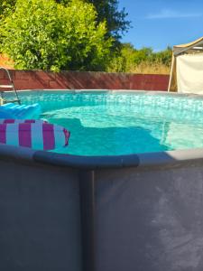 a large swimming pool with alatable at A Nogueira in Tui