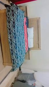 a group of pillows are hanging on a wall at Dream suits in Lower Topa
