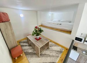 a small room with a bed and a table at Sutorange in Sutomore