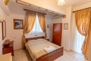 a bedroom with a bed with two towels on it at VILLA Vasilios EXARHOS in Paralia Katerinis +34 photos