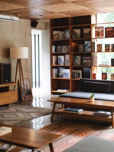 a living room with a couch and a coffee table at Surf Motel Canggu in Canggu