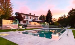 a villa with a swimming pool and a house at Il Sentiero dei Goti San Marino e Montefeltro in Monte Grimano Terme