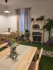 a living room with a table and a dining room at Pajtl indoor glamping in Črna na Koroškem