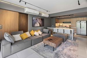 a living room with a couch and a table at BirdNest Vacation homes at Marassi marina in El Alamein