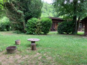 a bench sitting in the middle of a yard at Studio Tennis Riviere in Annecy