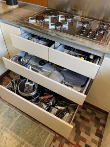 a kitchen drawers filled with pots and pans at Il Sentiero dei Goti San Marino e Montefeltro in Monte Grimano Terme