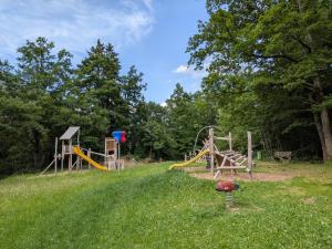 a park with a playground with a slide at Ferienwohnung Leitner in Grins