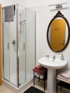 a bathroom with a shower and a sink and a mirror at Civico 3 - Alloggio Turistico in Fiano Romano