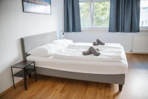 a bed in a bedroom with two pillows on it at Wilten 1 in Innsbruck