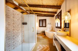 a bathroom with a glass shower and a sink at ruralhomemora in Mora de Rubielos +136 photos