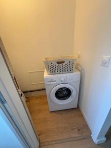 a washing machine with a basket on top of it at Maison de vacance à DAX in Dax
