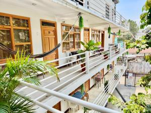 a balcony of a building with plants at Hotel Xetawaa´l in San Pedro La Laguna