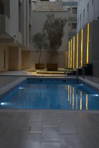 a large swimming pool in a large building at Royal Palace Hotel - Al Olaya in Riyadh