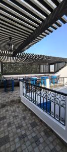 a patio with tables and chairs on a balcony at Dar Mounia Les Oudayas in Rabat +67 photos