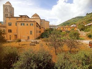 a large building with a clock tower in a city at Il sogno di Tania in Pescia