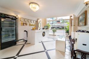 a restaurant with a counter and chairs in a room at MÊ KÔNG HOTEL - Hotel H79 in Ho Chi Minh City