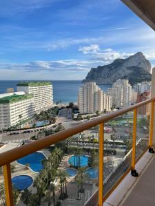 a view of the ocean from the balcony of a resort at Flamenco Ambar Luxury Apartment 15 Planta in Calpe