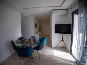 TV i/ili multimedijalni sistem u objektu Appartement Haut Standing - 5 personnes - Résidence Gardénia avec Piscine - Parking
