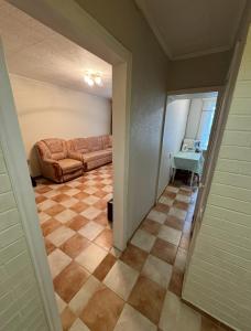 a hallway with a living room with a couch at Odesa Krasna, 8 Apart in Odesa