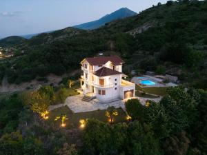 an aerial view of a house on a hill at Panorama Hills Entire Villa in Gjirokastër