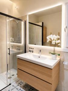 a bathroom with a sink and a shower at CaL QuEROL Select One in Puigcerdà +11 photos