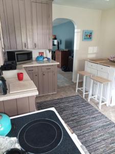 a kitchen with a stove top in a room at Binghamton Studio in Binghamton +9 photos