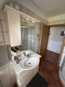 a bathroom with a sink and a mirror at MMMM in Bovec +55 photos