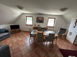 a large living room with a table and chairs at MMMM in Bovec